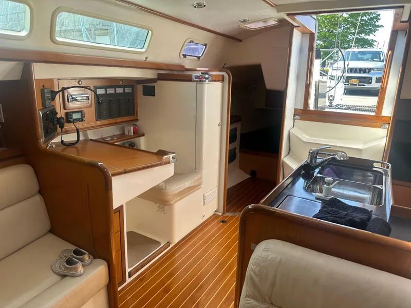 Slide: The Image of Interior of a 2001 Farr Concordia with wooden floors and modern amenities. - 13
