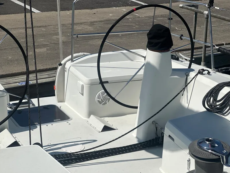 Slide: The Image of The image shows the cockpit of a 2001 Farr Concordia with a steering wheel and ropes. - 3