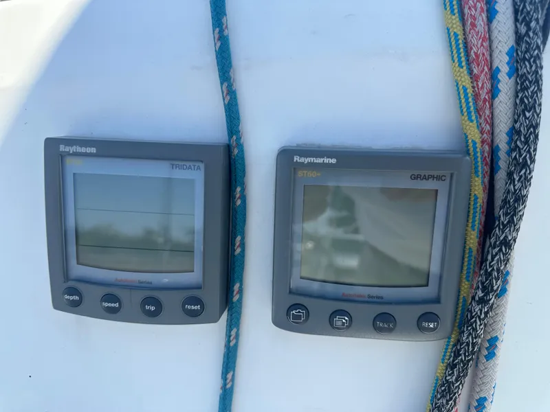 Slide: The Image of Two Raymarine instruments on a boat with colorful ropes beside them. - 19
