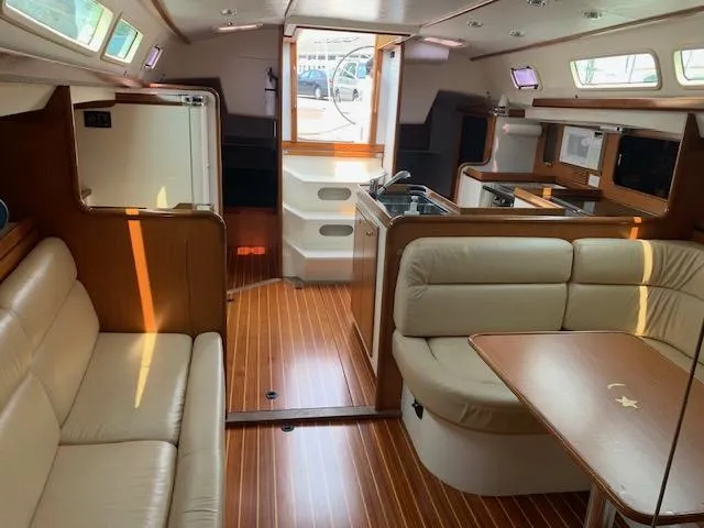 Slide: The Image of Interior of a 2001 Farr Concordia with elegant wood finish and comfortable seating. - 32
