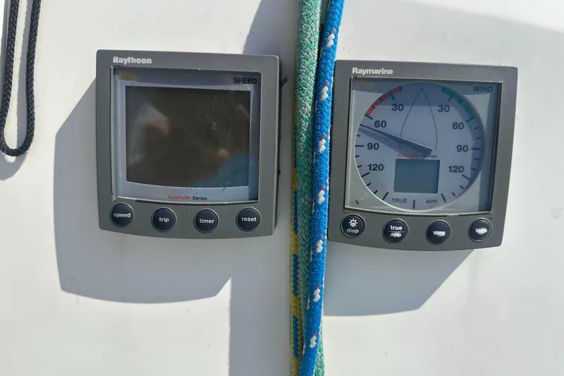 Slide: The Image of Two Raymarine instruments on a boat, one for speed and one for wind direction. - 41