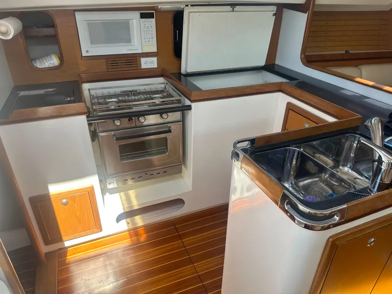 Slide: The Image of Galley of a 2001 Farr Concordia with stove, sink, and microwave. - 7