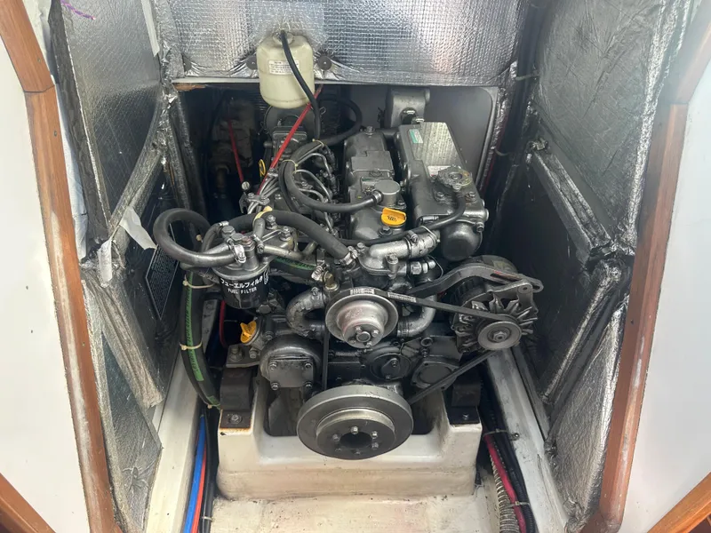 Slide: The Image of An engine inside a boat with insulation on the walls. - 16