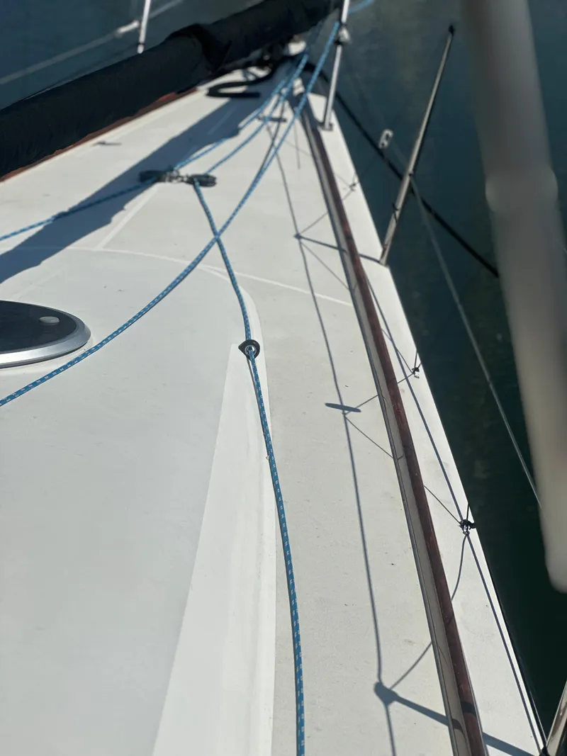 Slide: The Image of Close-up of a 2001 Farr Concordia yacht deck with blue ropes. - 20