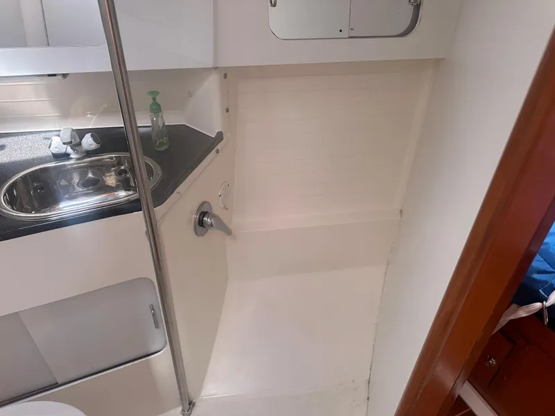 Slide: The Image of Interior of a yacht with a sink and mirror. - 10