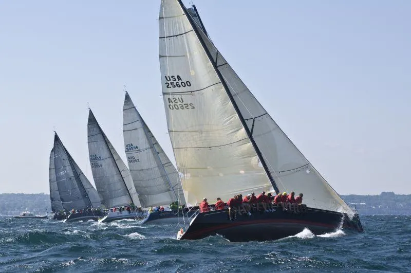 Slide: The Image of Several sailboats racing on the sea with strong winds. - 23