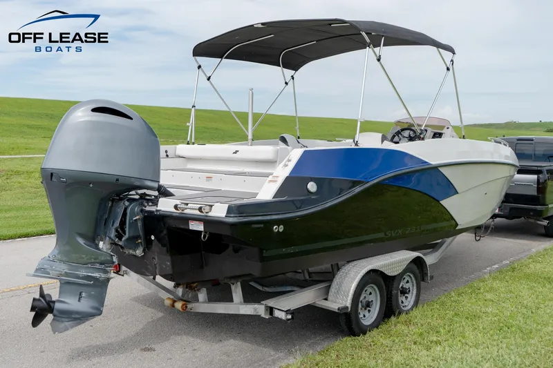 Slide: The Image of 2022 Starcraft SVX 231 OB boat on trailer with outboard motor. - 2
