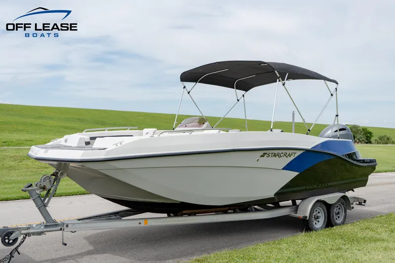 Slide: The Image of 2022 Starcraft SVX 231 OB boat on trailer with bimini top. - 8