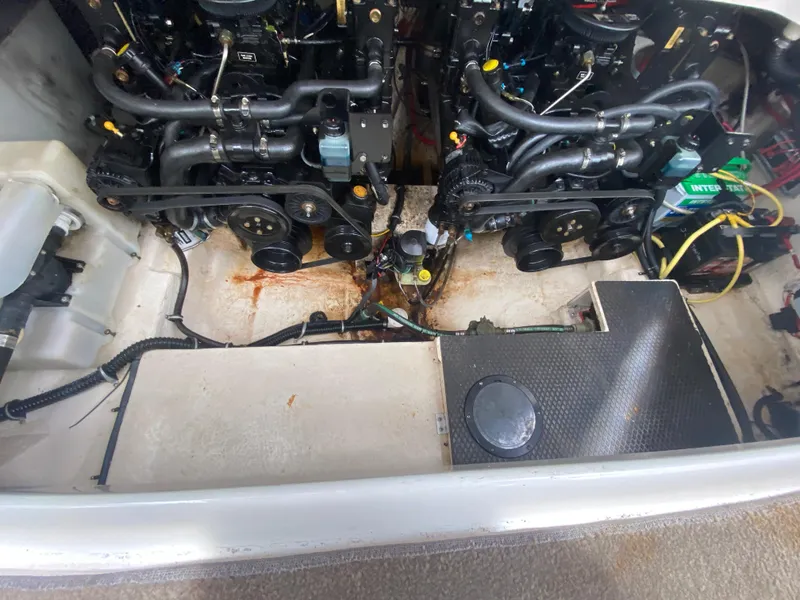 Slide: The Image of Engine compartment of a 2005 Chaparral 290 Signature boat, showing dual engines and wiring. - 36