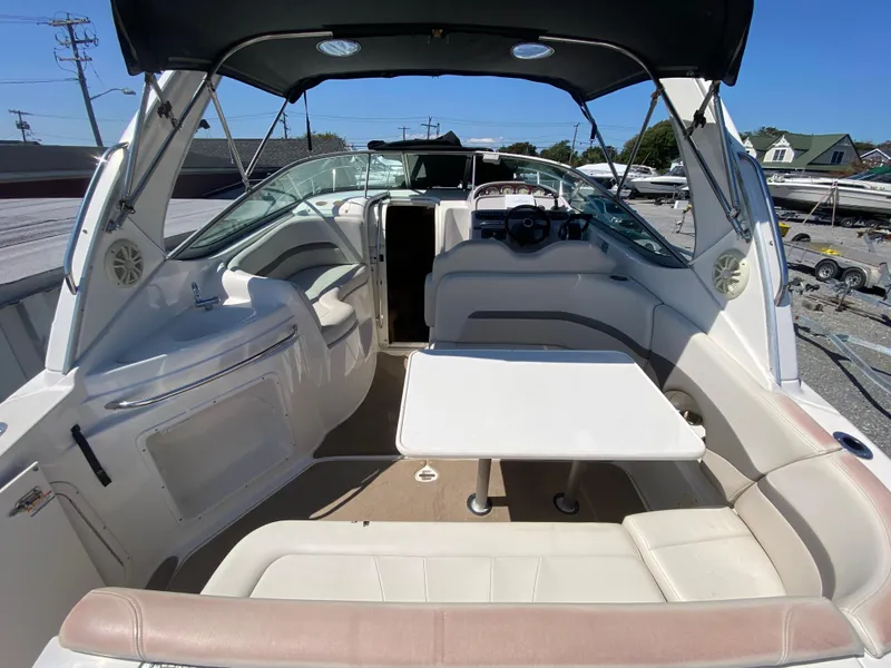 Slide: The Image of 2005 Chaparral 290 Signature boat interior with seating and table. - 12