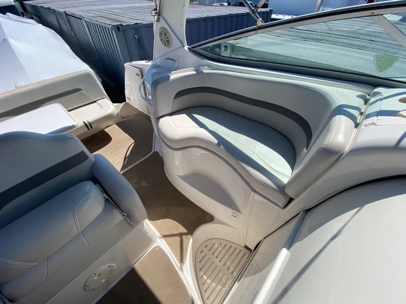 Slide: The Image of 2005 Chaparral 290 Signature boat interior with cushioned seating and sleek design. - 15