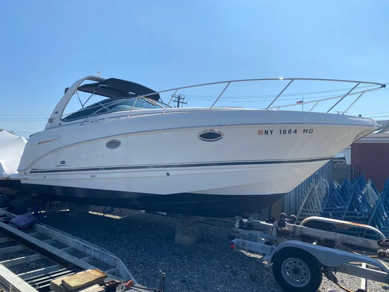 Slide: The Image of 2005 Chaparral 290 Signature boat on trailer, side view under clear sky. - 3