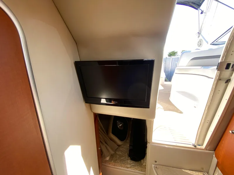 Slide: The Image of 2005 Chaparral 290 Signature interior with mounted flat-screen TV. - 34