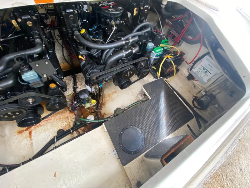Slide: The Image of Engine compartment of a 2005 Chaparral 290 Signature boat, showing dual engines and wiring. - 37