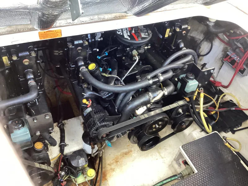 Slide: The Image of Engine compartment of a 2005 Chaparral 290 Signature boat. - 38