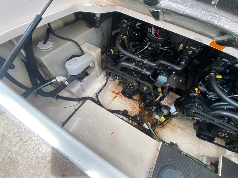 Slide: The Image of Engine compartment of a 2005 Chaparral 290 Signature boat, showing mechanical components and wiring. - 40