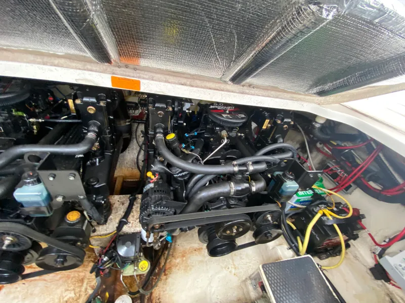 Slide: The Image of Engine compartment of a 2005 Chaparral 290 Signature boat, showcasing mechanical components. - 43