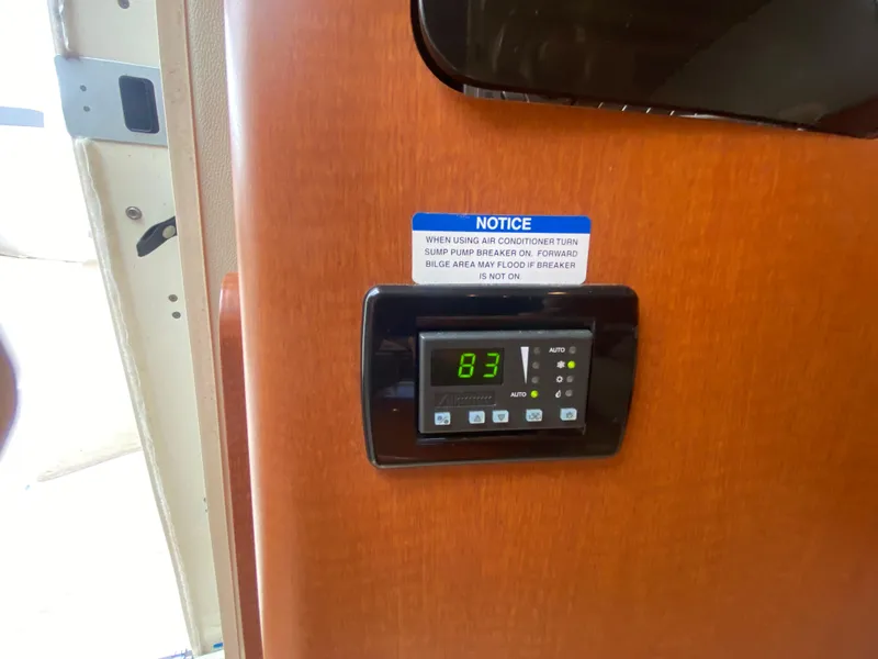 Slide: The Image of Thermostat display on 2005 Chaparral 290 Signature boat, showing temperature at 83 degrees. - 45