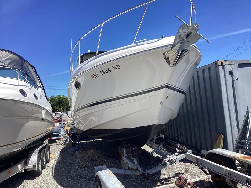 Slide: The Image of 2005 Chaparral 290 Signature boat on a trailer in a storage yard. - 7