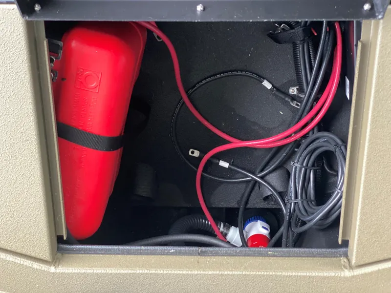 Slide: The Image of Boat storage compartment with red fuel tank and cables, Thor 1860 model, 2023. - 10
