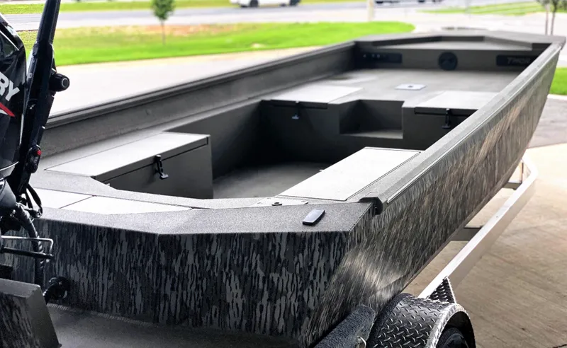 Slide: The Image of 2023 Thor 1860 boat on trailer, featuring a sleek, modern design. - 11