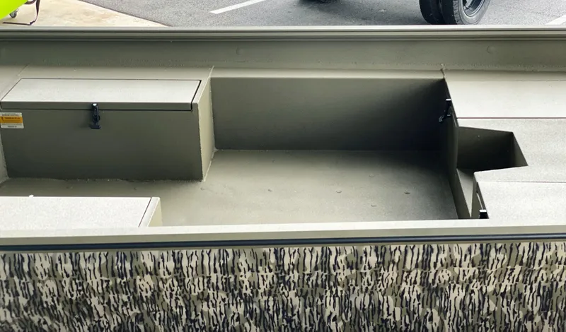 Slide: The Image of Thor 1860 boat interior, 2023 model, featuring storage compartments and camouflage design. - 7