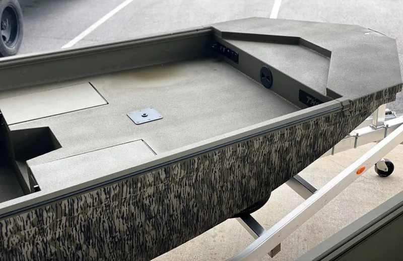 Slide: The Image of 2023 Thor 1860 boat with camouflage design on a trailer. - 8