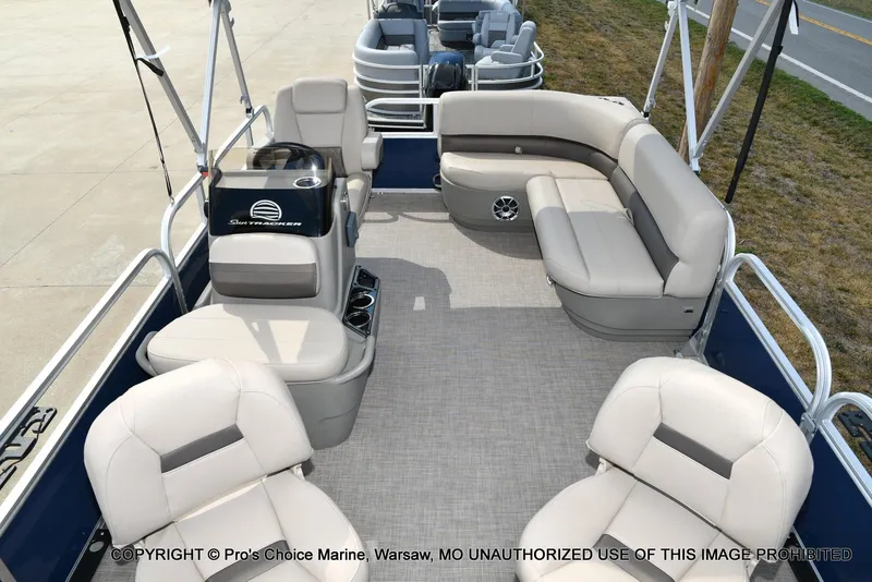 Slide: The Image of 2025 Sun Tracker Bass Buggy 16 XL Select pontoon boat interior with plush seating. - 16