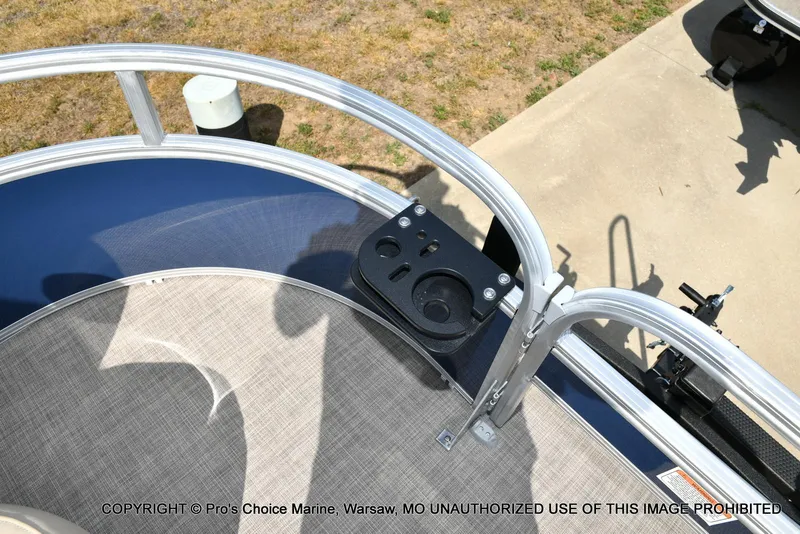 Slide: The Image of 2025 Sun Tracker Bass Buggy 16 XL Select boat deck with cup holders and railing. - 18