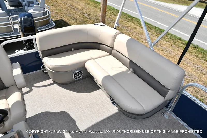 Slide: The Image of 2025 Sun Tracker Bass Buggy 16 XL Select pontoon boat interior with beige seating. - 24