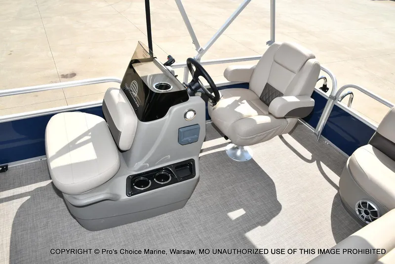 Slide: The Image of 2025 Sun Tracker Bass Buggy 16 XL Select interior with helm and seating. - 25