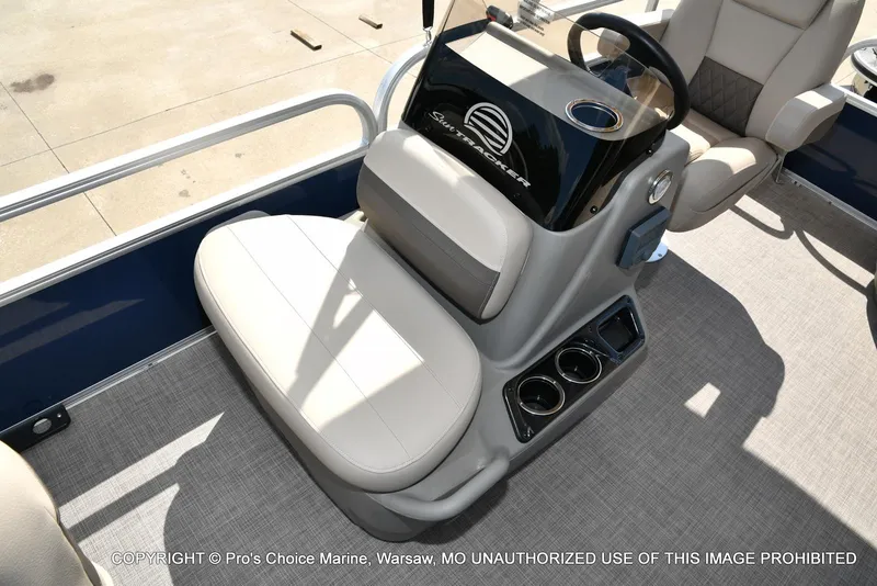 Slide: The Image of 2025 Sun Tracker Bass Buggy 16 XL Select boat interior with steering console and seating. - 26