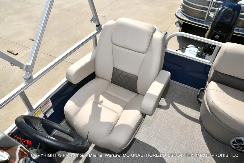 Slide: The Image of 2025 Sun Tracker Bass Buggy 16 XL Select boat seat and steering wheel. - 29