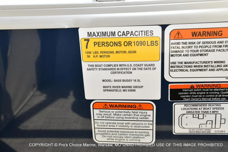 Slide: The Image of Sun Tracker Bass Buggy 16 XL Select 2025 capacity label, 7 persons or 1090 lbs, safety warnings. - 31