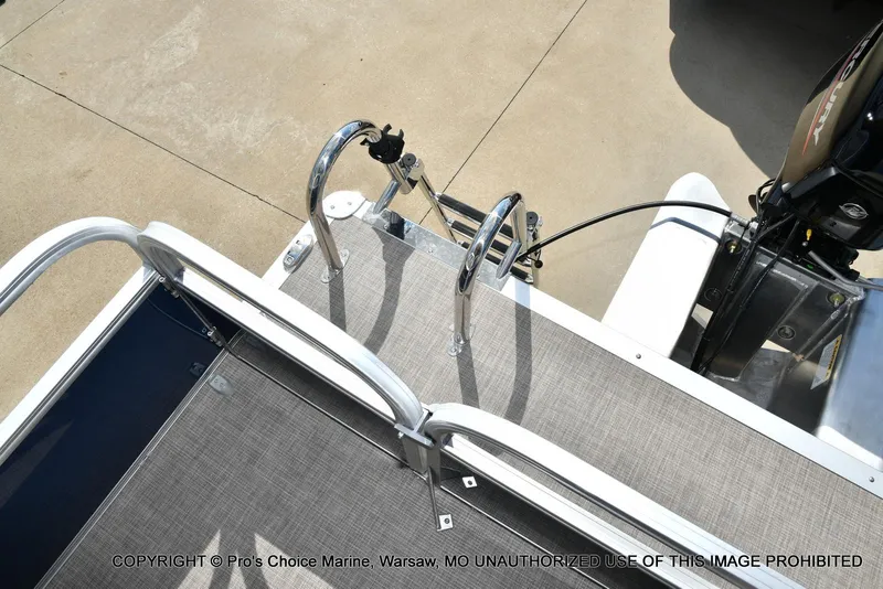 Slide: The Image of 2025 Sun Tracker Bass Buggy 16 XL Select boat deck with motor and railing. - 34