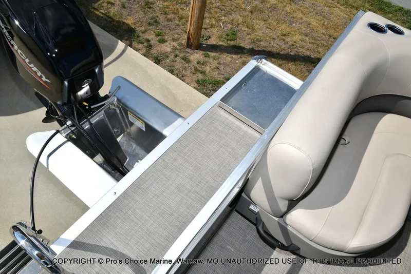 Slide: The Image of 2025 Sun Tracker Bass Buggy 16 XL Select pontoon boat with Mercury engine and beige seating. - 35
