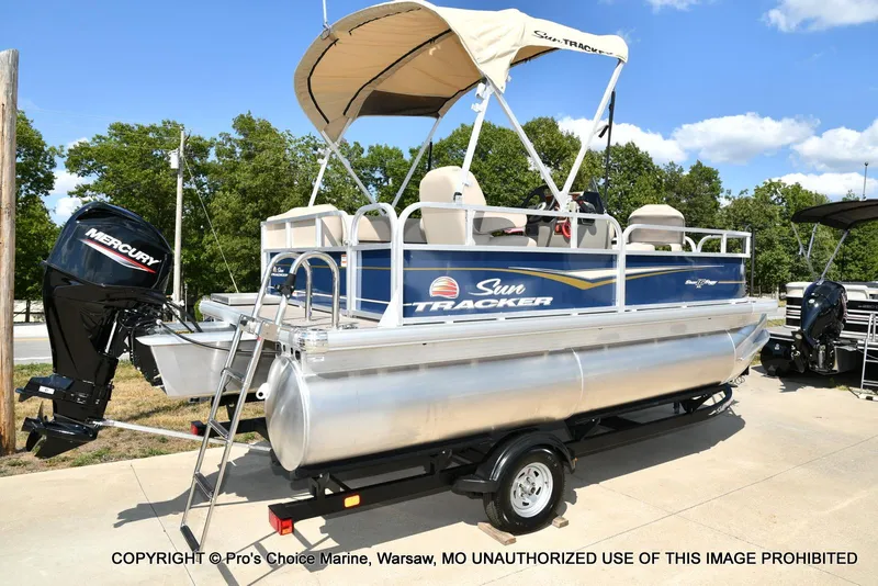 Slide: The Image of 2025 Sun Tracker Bass Buggy 16 XL Select pontoon boat with Mercury outboard motor. - 7
