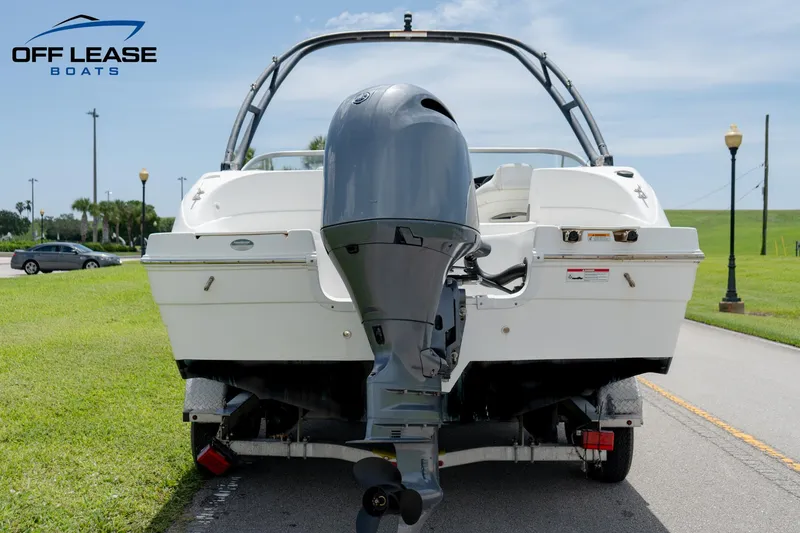 Slide: The Image of 2020 Hurricane 217 SD boat on trailer, rear view, outdoors. - 11