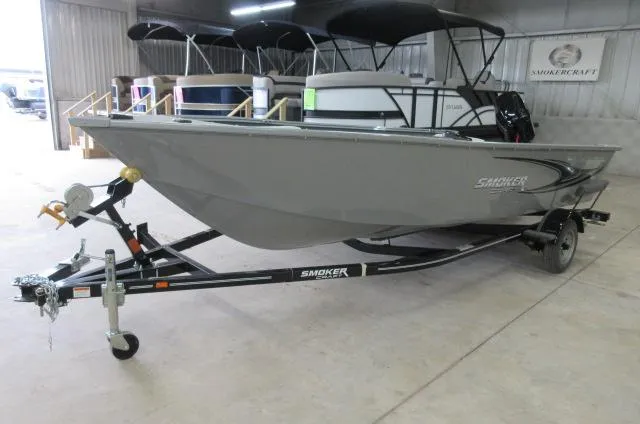 The Image of 2023 Smoker Craft Freedom 160 TL boat on trailer in showroom. - 0