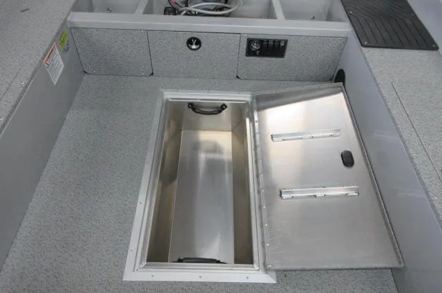 Slide: The Image of 2023 Smoker Craft Freedom 160 TL boat interior with open storage compartment. - 5