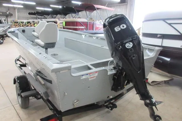 Slide: The Image of 2023 Smoker Craft Freedom 160 TL boat with 60 HP outboard motor in showroom. - 9