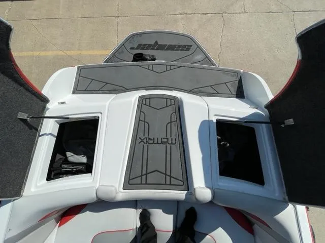 Slide: The Image of 2015 Sanger V 212 boat interior with open storage compartments. - 12