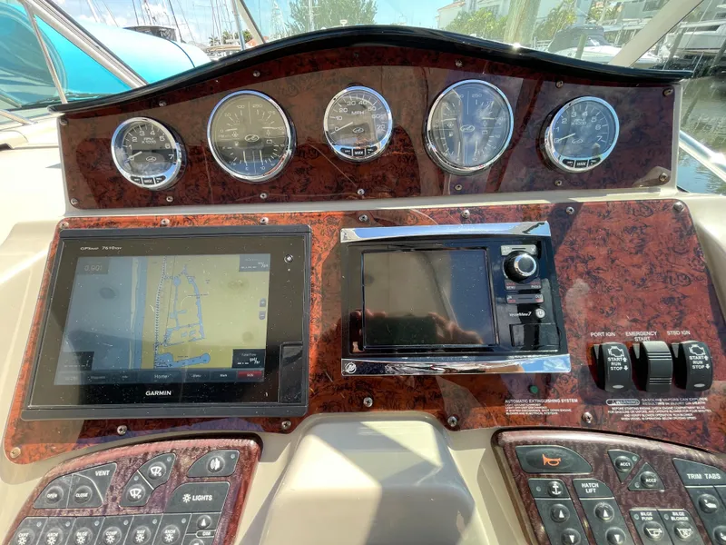 Slide: The Image of Dashboard of 2007 Sea Ray 310 Sundancer with navigation and control panels. - 20