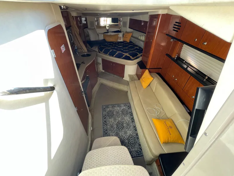 Slide: The Image of Interior of 2007 Sea Ray 310 Sundancer with cozy seating and modern amenities. - 23