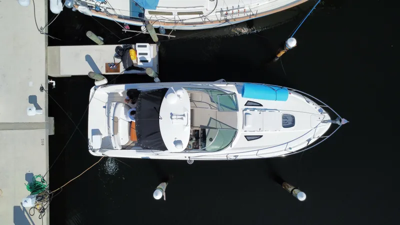 Slide: The Image of Aerial view of a 2007 Sea Ray 310 Sundancer docked at a marina. - 7