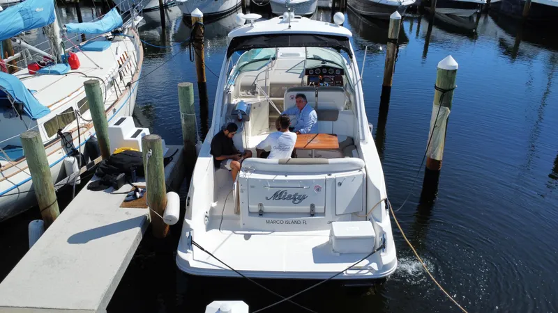 Slide: The Image of 2007 Sea Ray 310 Sundancer docked with people onboard. - 9