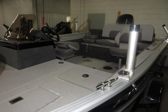 Slide: The Image of 2023 Smoker Craft Pro Angler XL 171 boat interior with seating and storage compartments. - 3