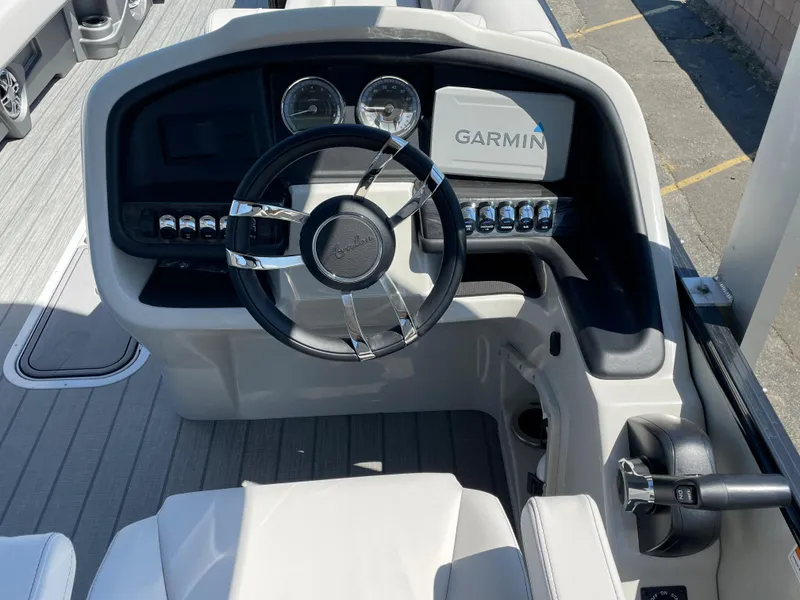 Slide: The Image of 2024 Avalon 2585 Catalina Funship dashboard with Garmin navigation system and sleek steering wheel. - 9