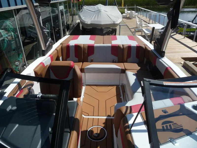 Slide: The Image of 2023 Malibu 21 LX boat interior with spacious seating and modern design. - 5