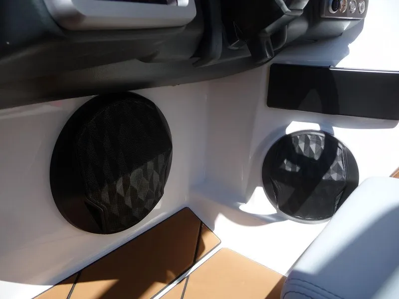 Slide: The Image of 2023 Malibu 21 LX boat interior speakers and dashboard. - 6